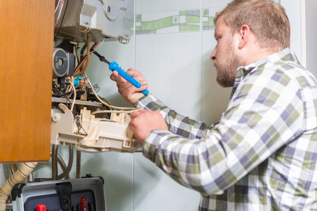 Technician repairing Gas Furnace