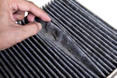 A dirty air filter on white background.